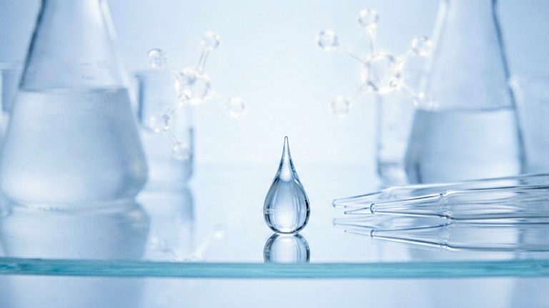 Laboratory glassware and serum droplet illustrating skin cell senescence research